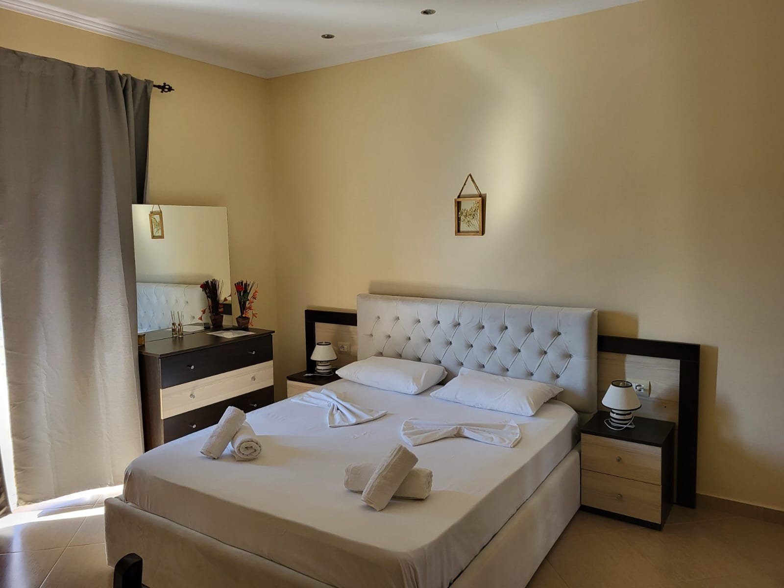 Spacious villa with private garden, outdoor dining table, and lush Mediterranean plants